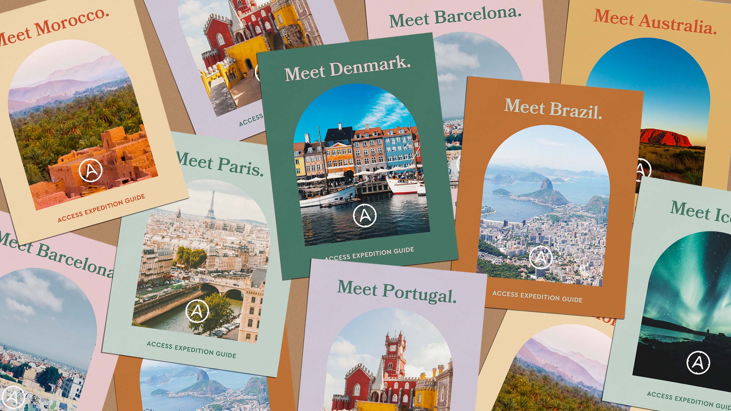 A flatlay of colorful travel guides for travel brand Access Travel