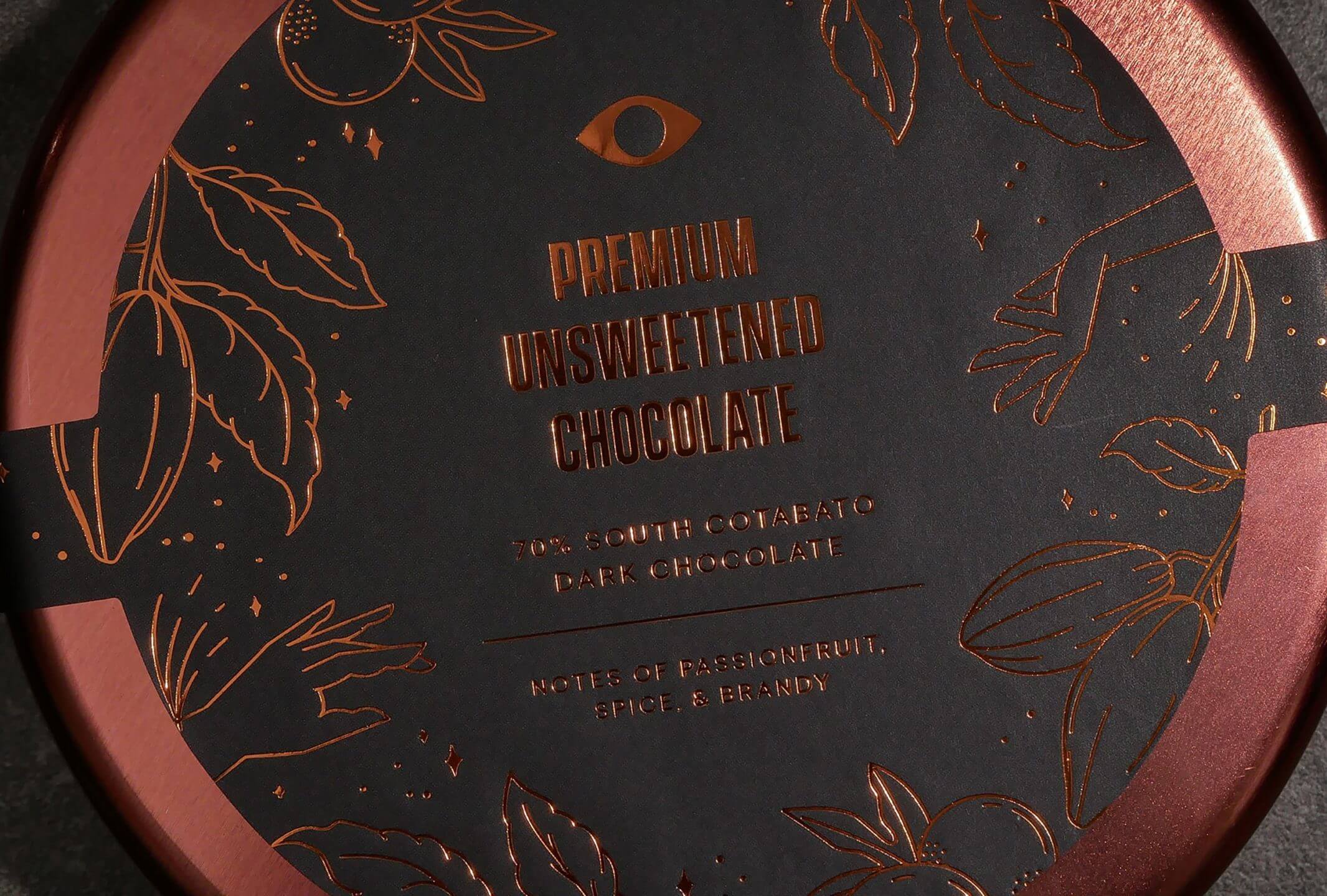 Chocolate packaging with rose gold foil stamping on a rose gold tin can