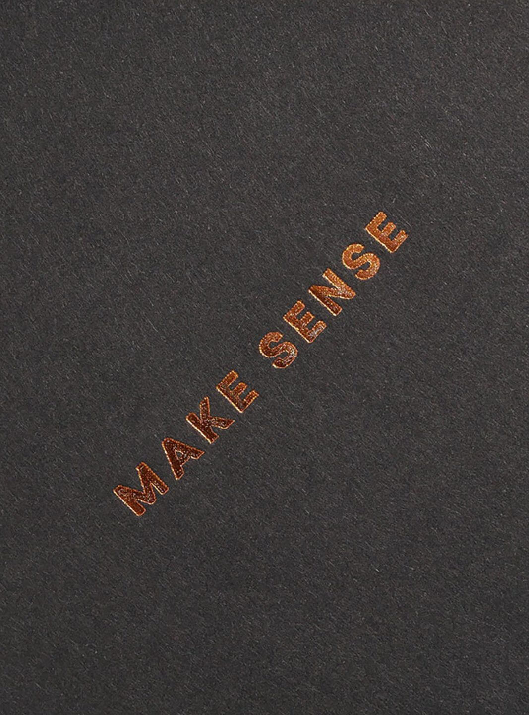 The words "Make Sense" in rose gold foil stamping