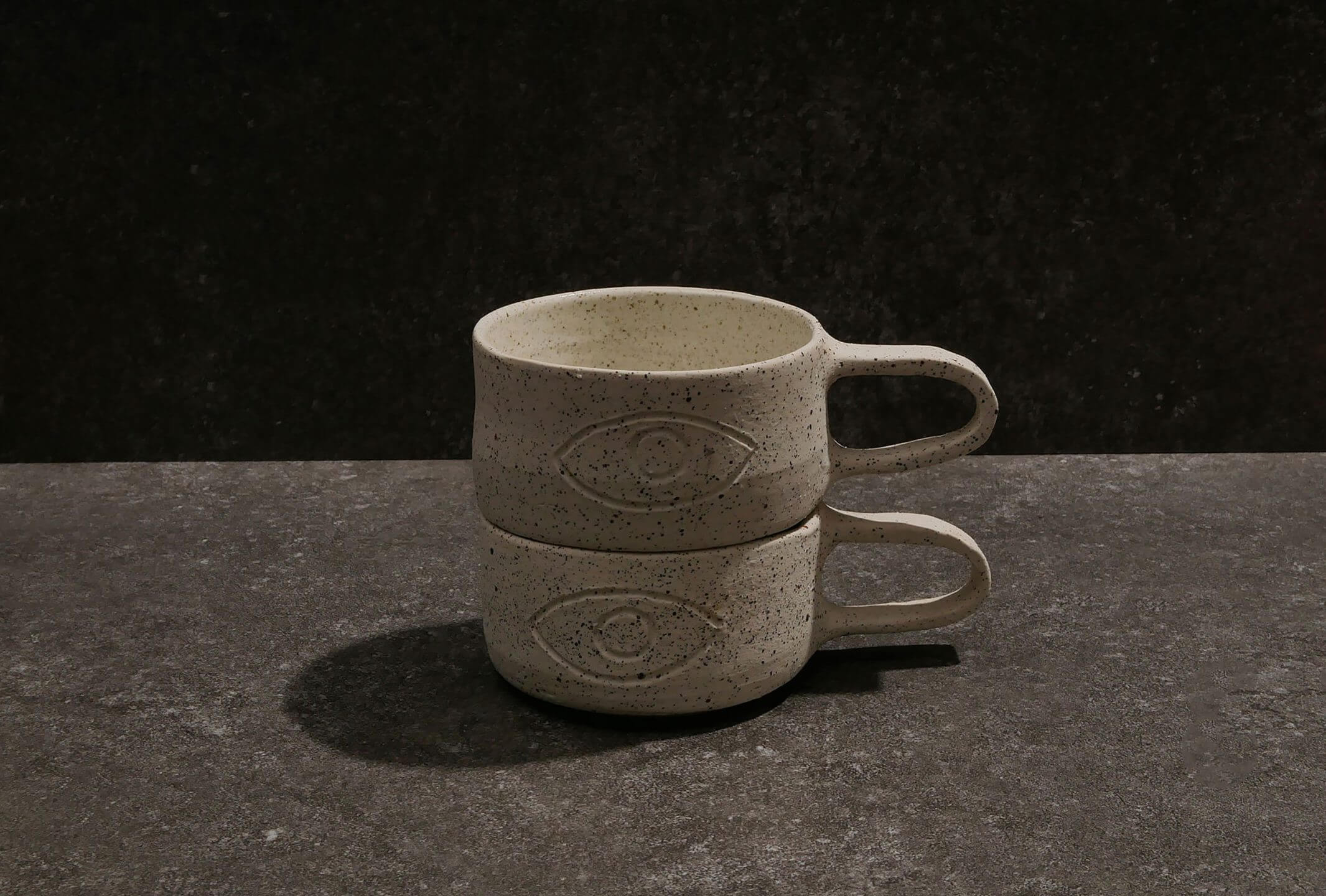 A Pair of Serious Studio limited edition stackable speckled ceramic mugs
