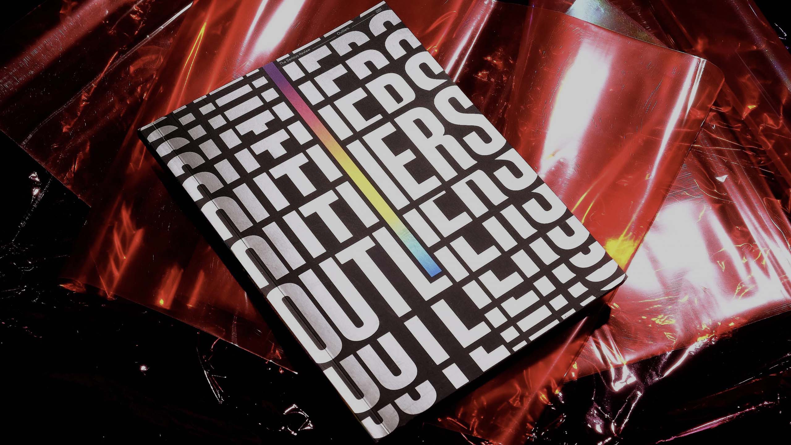 The front cover of Outliers, the first volume of The Serious Review