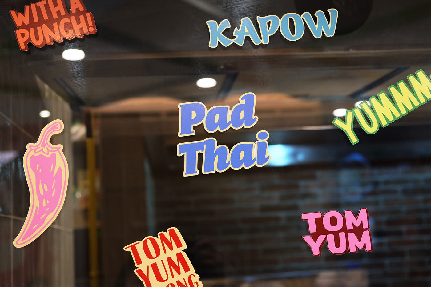 Typography decal stickers in the store front of Thai food and beverage brand Easy Tiger