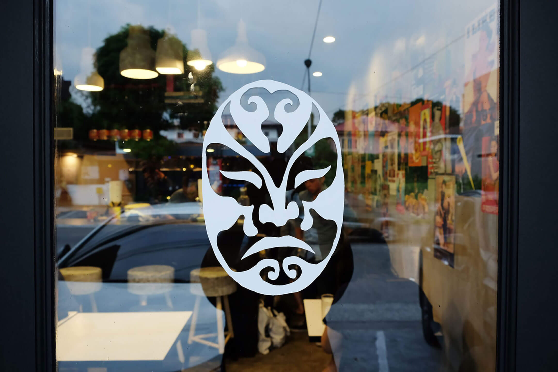 Restaurant decal of a luchador mask on a window designed for Mexican food and beverage brand La Chinesca
