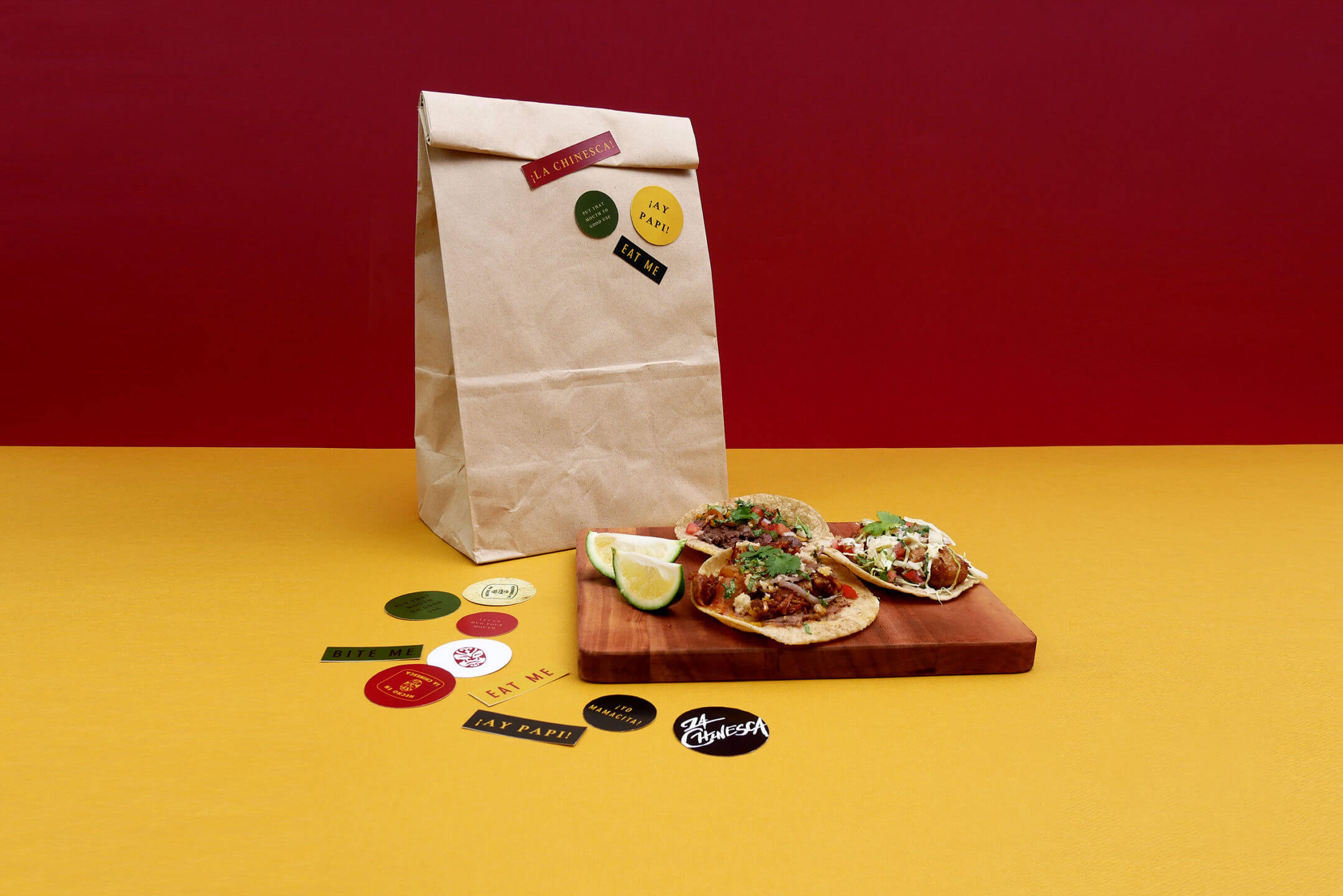 La Chinesca's tacos, stickers, and paper bag packaging
