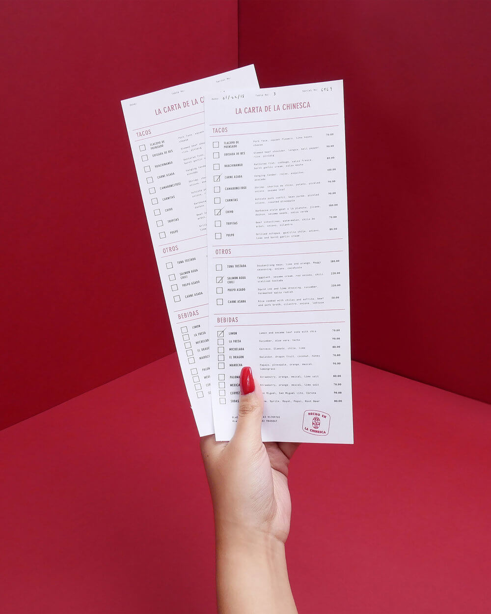A hand holding La Chinesca's menu