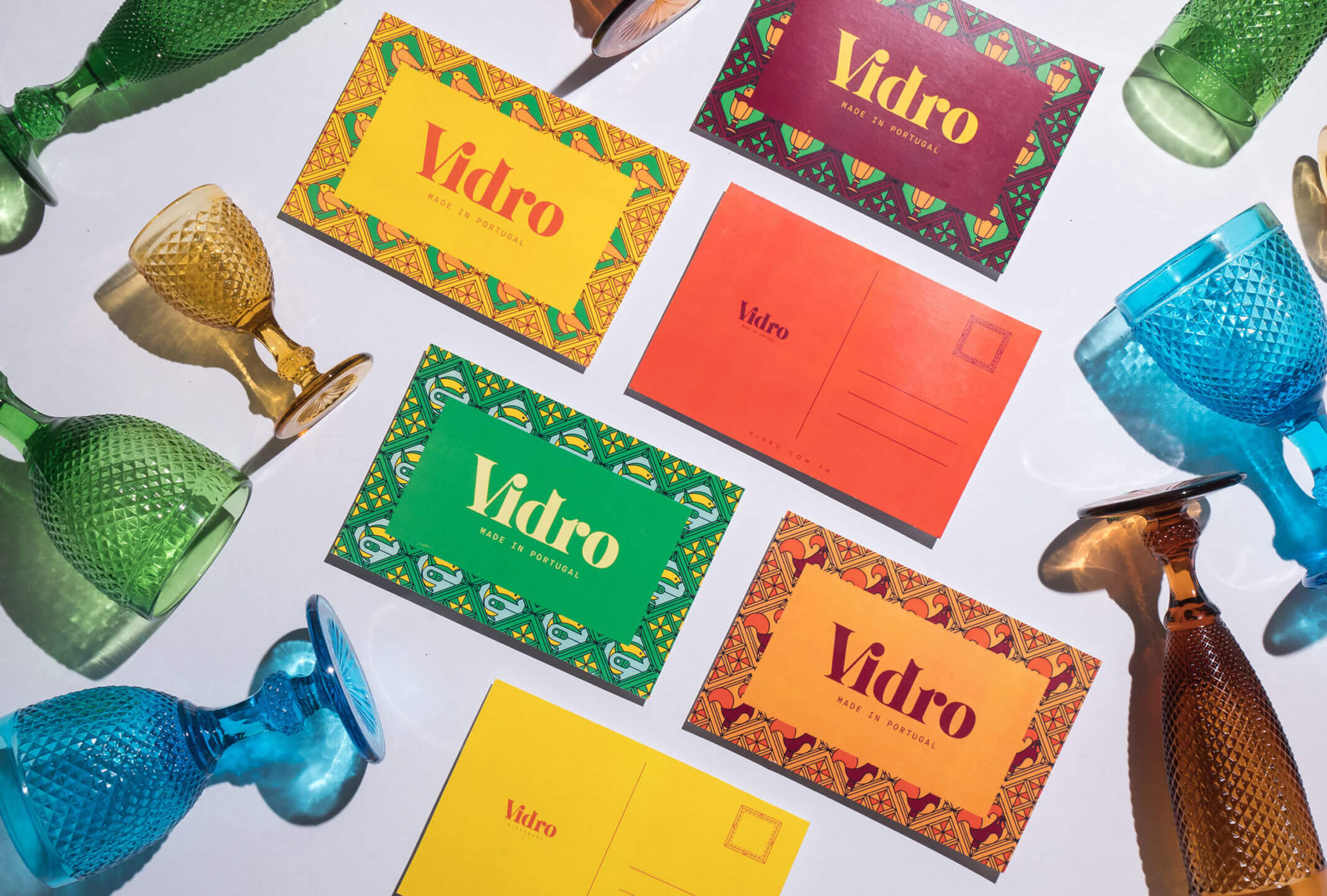 Colorful products and patterns on a postcard design for Portuguese glassware brand Vidro