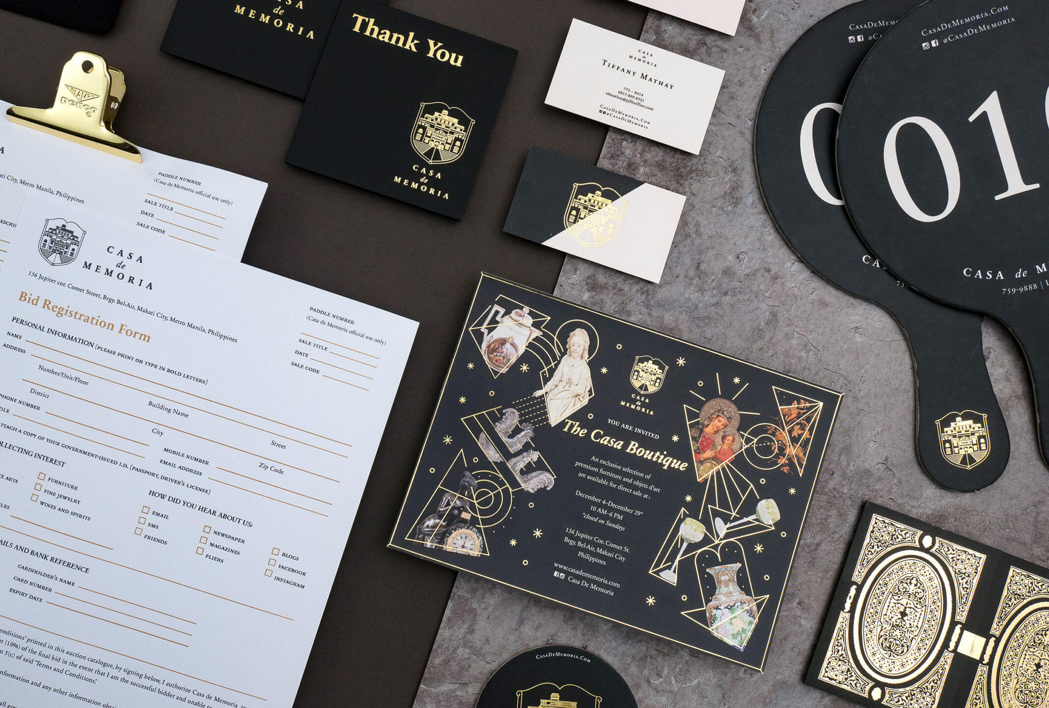 The elegant branding and collaterals set with gold foil details for auction house brand Casa de Memoria