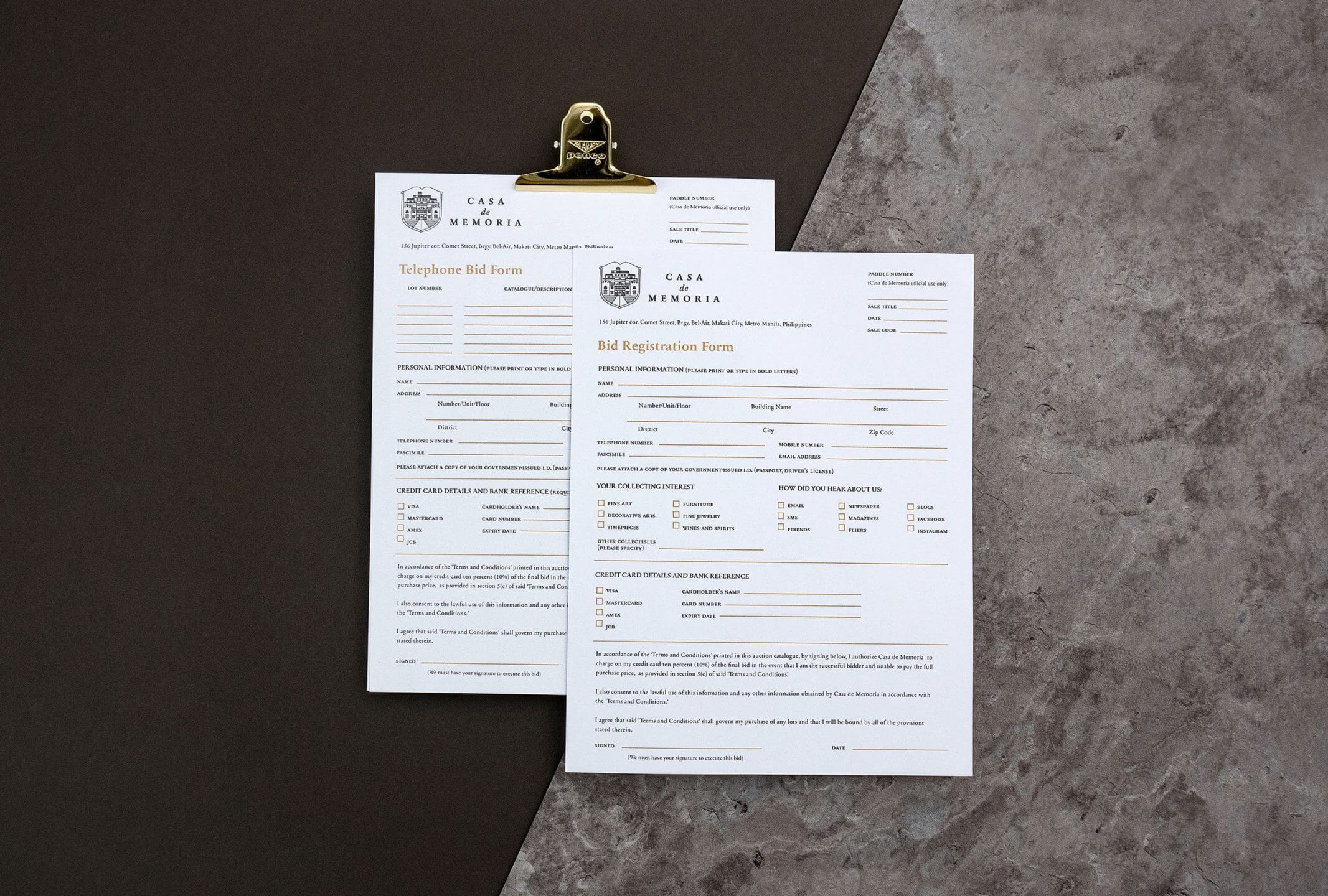 A studio shot of bid registration forms designed for auction house brand Casa de Memoria