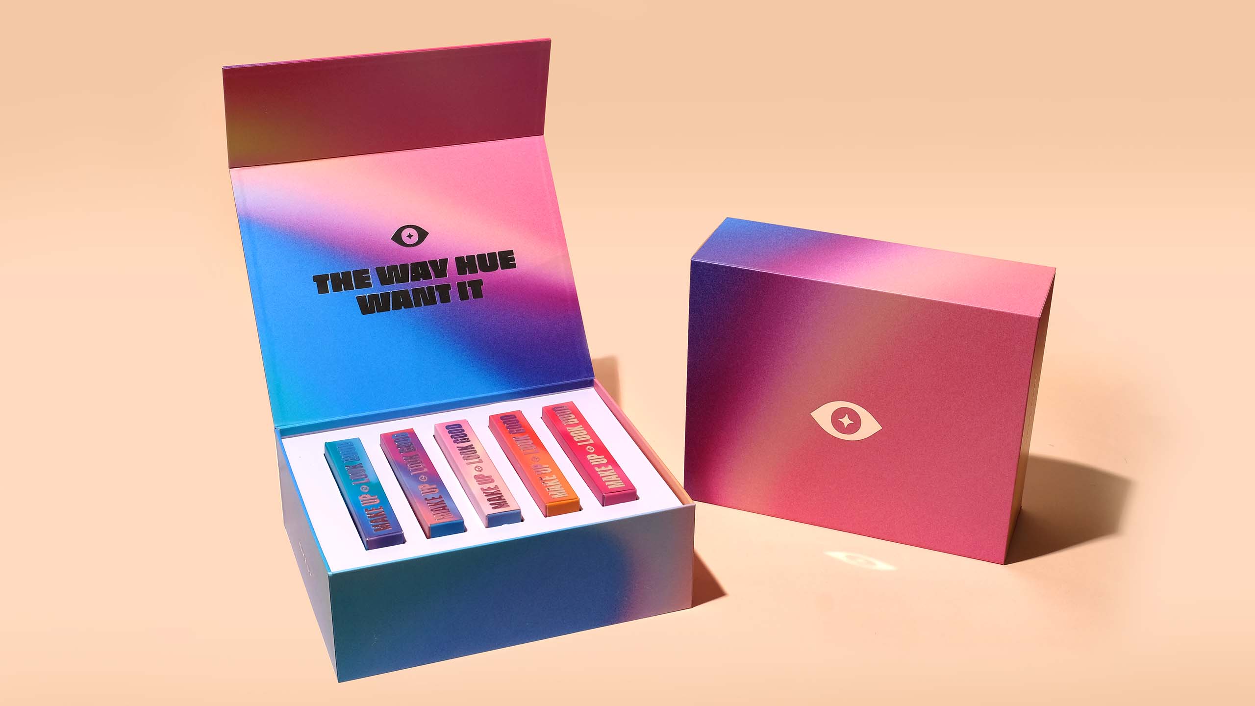 Imaginary cosmetic brand Serious Face's iconic silver and gradient packaging